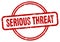 serious threat stamp. serious threat round vintage grunge label.