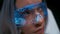 Serious VR glasses girl face closeup. Woman watching through smart goggles