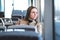 Serious woman in train or bus looking through the window