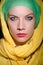 Serious woman wearing colourful headscarf