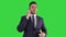 Serious worried businessman talking on cellphone on a Green Screen, Chroma Key.