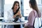 Serious young gynecologist giving guidelines to his pregnant patient in the clinic