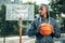 Serious young man looking at the basketball court