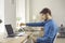 Serious young man reading business letter or some documents he got by paper mail