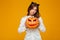 Serious young woman dressed in crazy cat halloween costume