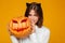 Serious young woman dressed in crazy cat halloween costume