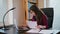 Serious Young Woman Looking on Documents.