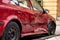 Seriously damaged side door of wine red Skoda Octavia car after traffic accident