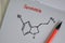 Serotonin molecule write on the paperwork. Structural chemical formula. Education concept