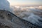 Serpentine road beyond the clouds at Babadag mountain