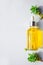Serum with natural vitamin C, cosmetic oil in a glass bottle with a pipette. Llight background