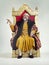 Servants Come hither. Studio shot of a richly garbed king sitting on a throne.