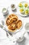 Served breakfast table - potato scones and boiled eggs on a light background, top view. Delicious brunch, snack