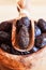 Served dried black olives in wooden olive bowl