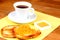 Served european breakfast: cup of coffee, toasts and jam