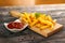 Served french fries on chopping board