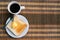 Served table for breakfast with toast, coffee and butter on tablemat