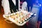 Server holding a tray of appetizers at banquet