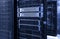 Server racks with mainframe disks cloud storage blue neon toning