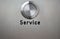 Service button on brushed steel