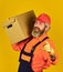Service delivery. Courier and delivery. Postman delivery worker. Handsome man red cap yellow background. Delivering