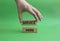 Service here symbol. Concept words Service here on wooden blocks. Beautiful green background. Businessman hand. Business and