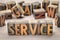 Service word abstract in wood type