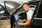 Serviceman in a car workshop