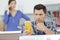 serviceman using multimeter to assess kitchen appliance