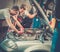 Servicemen in a car workshop