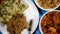 Serving Chicken Saag Masala And Mushroom Rice On A Plate