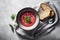 A serving of classic Ukrainian borscht is displayed in a bowl, highlighting Ukraine\\\'s culinary history. Generative AI