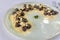 Serving of delicious Italian gnocchi with cheese tastefully presented on plate