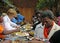 Serving food poor needy African people Christmas banquet Africa