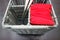 Serving kitchen utensils in a wicker basket with forks and knives on the table