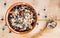 Serving muesli scattering of wild berries on wooden table