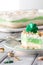 A serving of pistachio pudding and whip cream layered dessert for Saint Patrick`s Day, ready for eating.