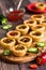 Serving platter of pepper jelly tarts.