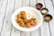 serving of round chicken croquettes with tomato and tomato sauces,