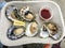 A serving of six fresh oysters served from a food truck in ucluelet, British Columbia, canada