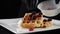 Serving sweet breakfast food, unhealthy eating. Sugar food concept. Fresh waffles served with ice-cream on white plate