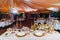 Serving table of bride and groom in tent open air.