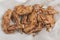 A serving of Teriyaki Chicken wings at a restaurant. On a tray covered with greaseproof paper