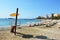 Ses Figueretes beach with lifeguard tower and empty beach without persons, no people, with umbrellas beach