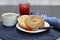 Sesame bagel, toasted and buttered with homemade strawberry jam