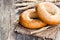 Sesame bagels and ears of wheat on sackcloth napkin