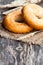 Sesame bagels and ears of wheat on sackcloth napkin