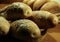 Sesame grain buns and wheat rolls on wooden table close up stock photo