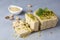 Sesame halva with pistachios on grey background. Top view. Copy space. Traditional middle eastern sweets. Jewish, turkish, arabic