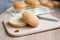 Sesame hamburger bun cut in half on a board in the kitchen, cooking at home